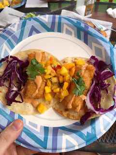 A picture of Fish Tacos (beer battered cod w/ mango salsa, chipotle mayo, red cabbage, cilantro).