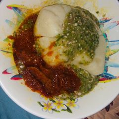 A picture of Semovita with okra soup and stew.