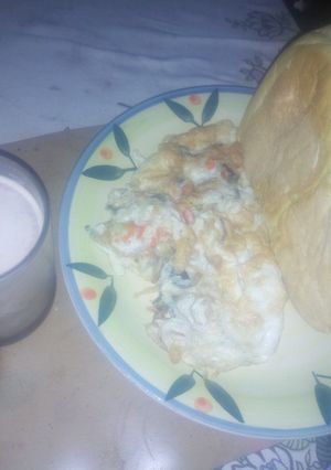 A picture of Bread and egg with beverage.