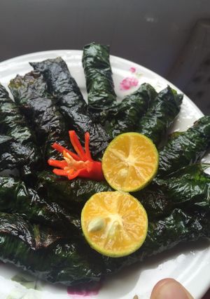 A picture of Fried Beef Wrapped in Betel Leaves.