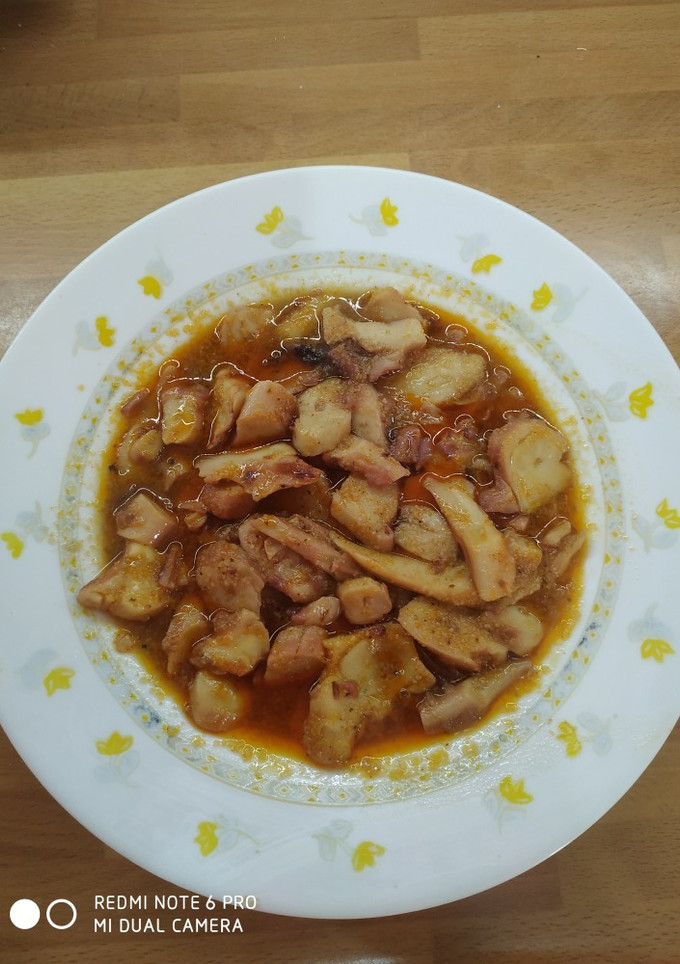 Una foto de Tacos de pota en salsa