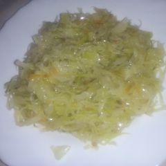 A picture of Fried cabbage with carrots.