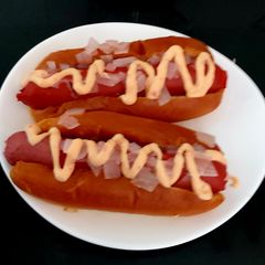 A picture of My Filling Hot Dogs with Onion and Brioche Bun.