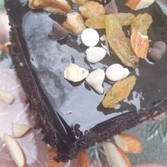 A picture of Nutty chocolate glazed brownies.
