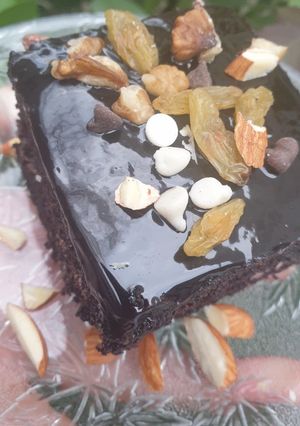 A picture of Nutty chocolate glazed brownies.
