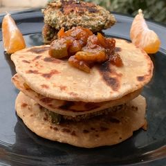A picture of Gajar Chunda oats beans aloo tikki fig chutney sandwich in Indian bread.