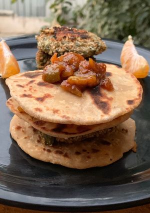 A picture of Gajar Chunda oats beans aloo tikki fig chutney sandwich in Indian bread.