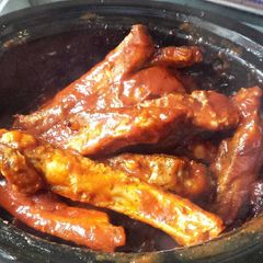 Slow cooked ribs in hunters sauce A picture of Slow cooked ribs in hunters sauce .