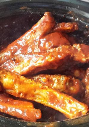 A picture of Slow cooked ribs in hunters sauce .