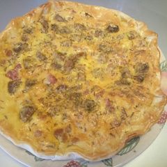 A picture of Torta salata - pancetta, mushroom and pecorino pie.