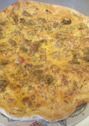 A picture of Torta salata - pancetta, mushroom and pecorino pie.