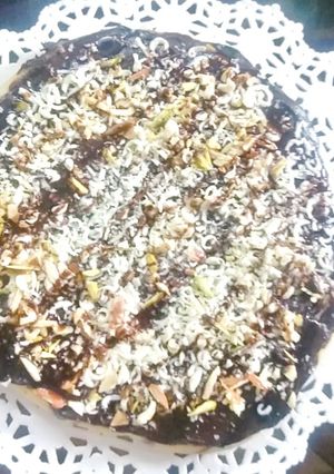 A picture of Dryfruit Chocolate Pizza 🍕 😍.