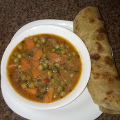 A picture of Soft layered chapati and beef stew#author marathon.