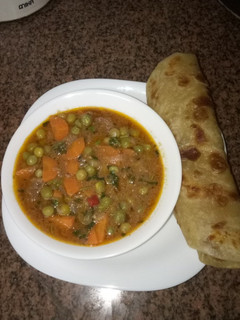 A picture of Soft layered chapati and beef stew#author marathon.