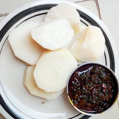 A picture of Boiled yam and scent leaf source.