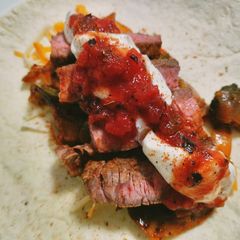 A picture of Spicy loaded beef fajitas.