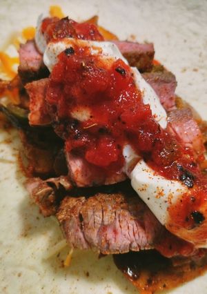 A picture of Spicy loaded beef fajitas.