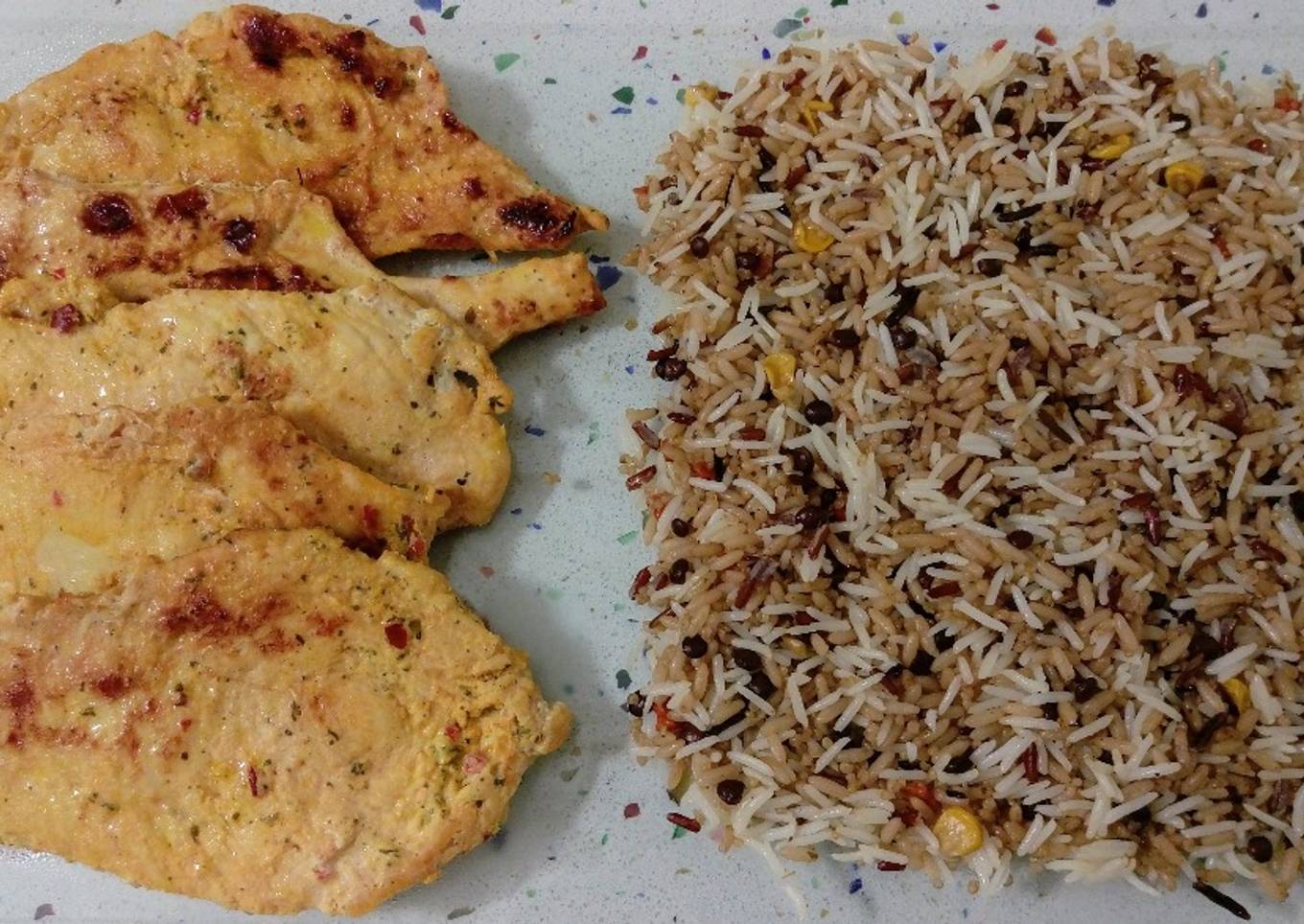 Marinated chicken breast in three dishes, fried rice and vegetables