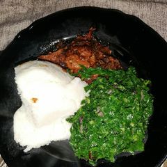 A picture of Sauté kales, spicy wet fried matumbo and ugali.