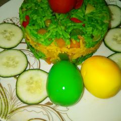 A picture of Potato fried rice and meat fried rice with coloured eggs.