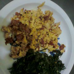 A picture of Fried eggs + Sautéed Kale.