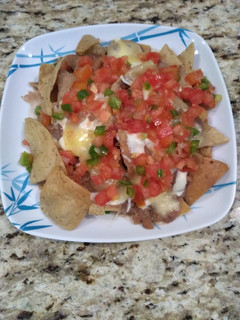 Una foto de Nachos con pico de gallo