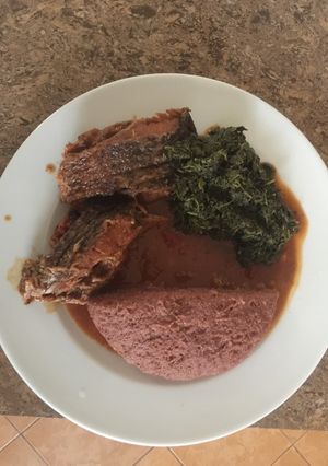 A picture of Tilapia, kienyeji greens and ugali.