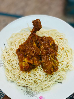 A picture of White Spaghetti with stew.