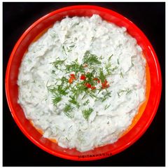 A picture of Tzatziki / Greek Style Cucumber (kheera) Raita.