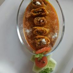 A picture of Stuff Besan Roll Curry.