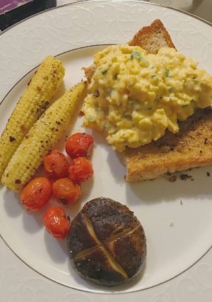 A picture of Breakfast of the day: scrambled eggs over toast.