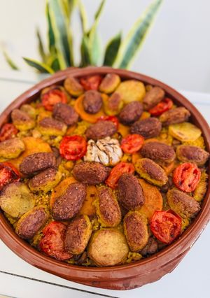 Una foto de Arroz al horno de Pascua. Con albóndigas de bacalao, garbanzos, castañas y pasas