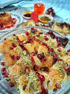 A picture of Pomegranate Pistachios Rabri Kunafa Rolls.