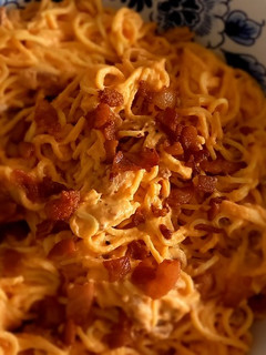 Una foto de Pasta con crema de tomate y guanciale