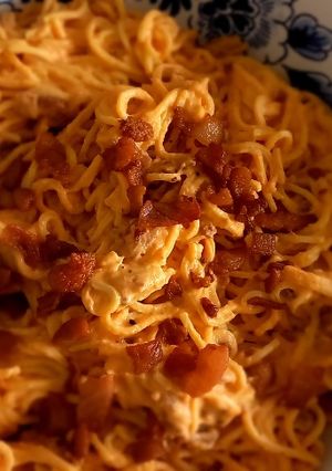 Una foto de Pasta con crema de tomate y guanciale