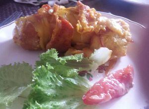 Una foto de Milanesas de pollo con queso envueltas con tocino