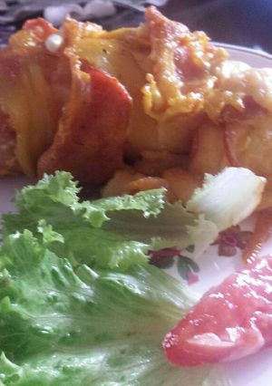 A picture of Chicken Milanese with Cheese Wrapped in Bacon.