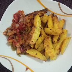A picture of Oven Roast Potatoes with pepper sauce.