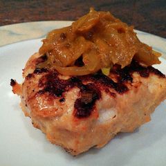 A picture of Goat cheese chicken burger with curried onions. .