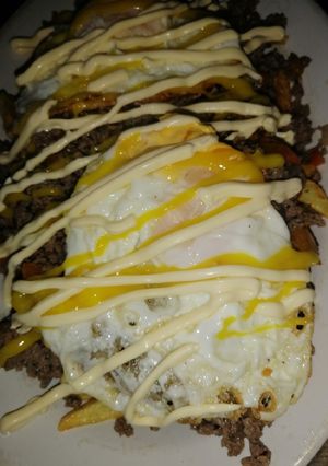 Una foto de Papas Fritas con carne molida