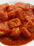 Carne y asadura de cerdo con tomate