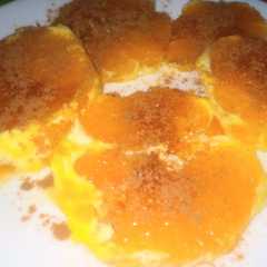 Una foto de Naranja con azúcar y canela