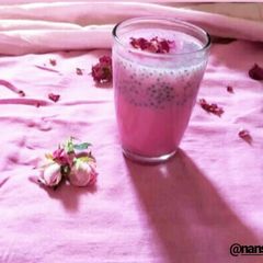 A picture of Rose milk with sabja seeds.