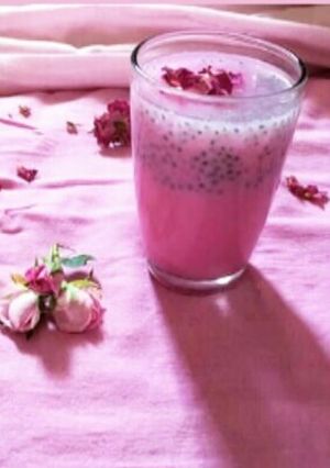 A picture of Rose milk with sabja seeds.