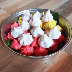 A picture of Colourful modak Happiness overloaded.