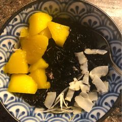 A picture of Indonesian-style Coconut Black Rice Pudding with Mango - vegan.