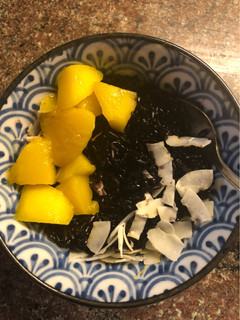 A picture of Indonesian-style Coconut Black Rice Pudding with Mango - vegan.