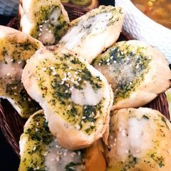 Pesto Cheese Baguette with Classic Vegetable Soup A picture of Pesto Cheese Baguette with Classic Vegetable Soup.