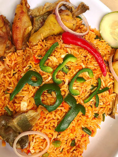 A picture of Vegetable Jollof rice and Chicken by Hon Ikeakam.