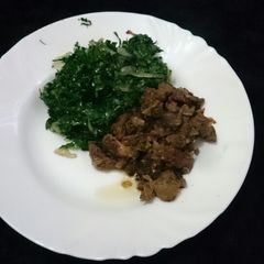 A picture of Fried beef with sukuma wiki.